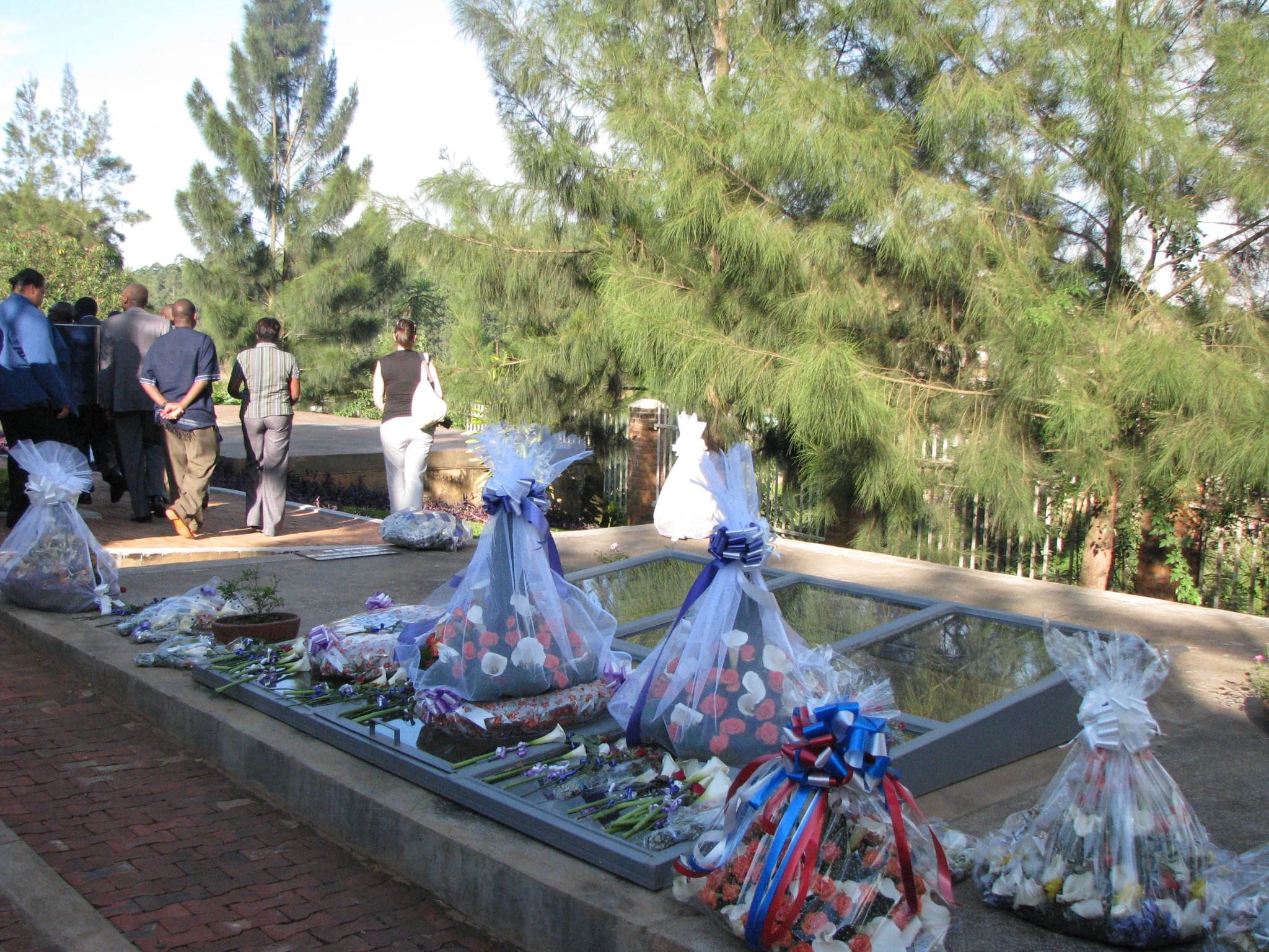 Exhibit inside Kigali Genocide Memorial showing photographs and artifacts, commemorating Rwanda's tragic history
