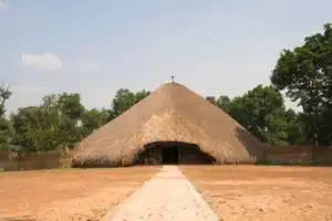 Large traditional thatched dome structure at the Kasubi Tombs, a key destination on Uganda cultural sites tours.